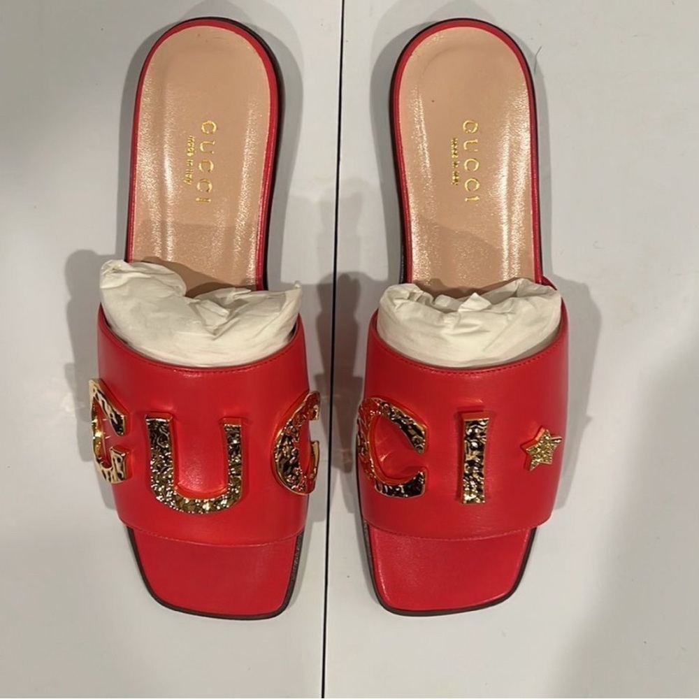 New in box Gucci Red Leather Slides with Gold Crystal Logo – Women’s Size 5.5